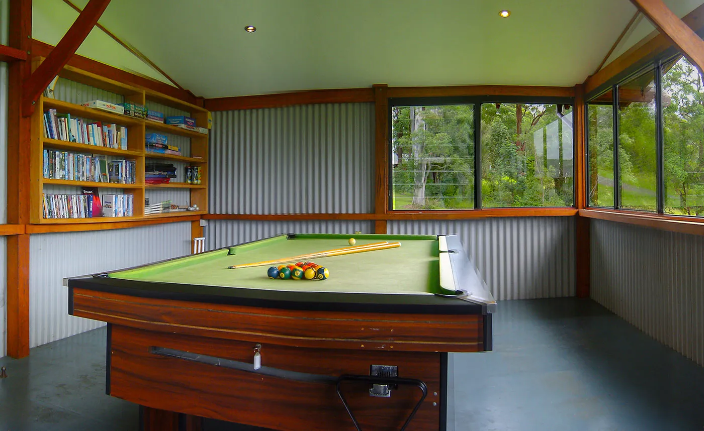 Games room with pool table, ping-pong table, books and board games