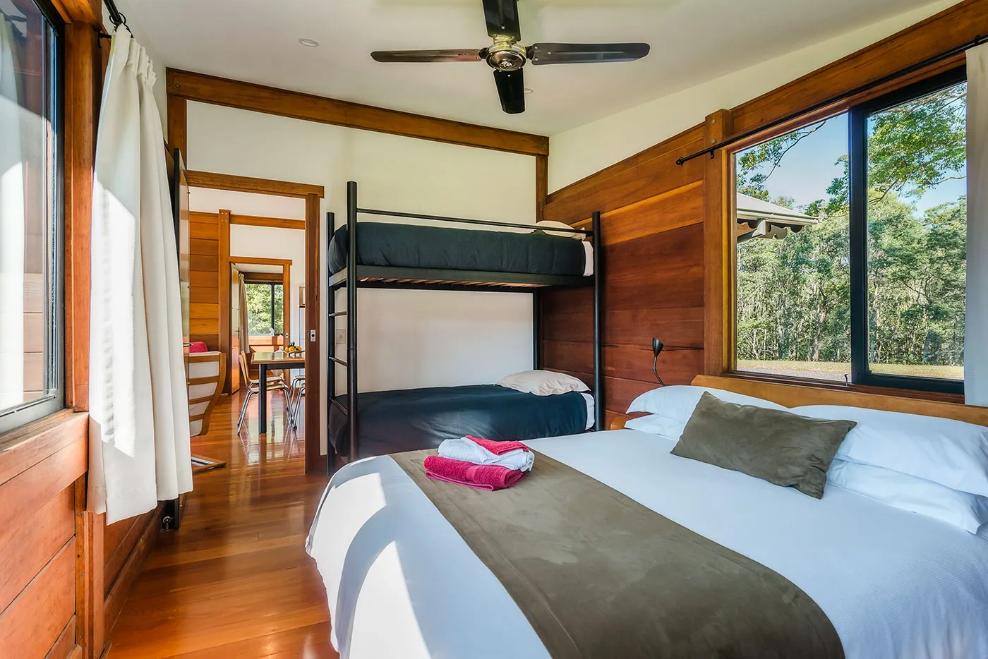 The Ridge second bedroom — queen bed and two single beds